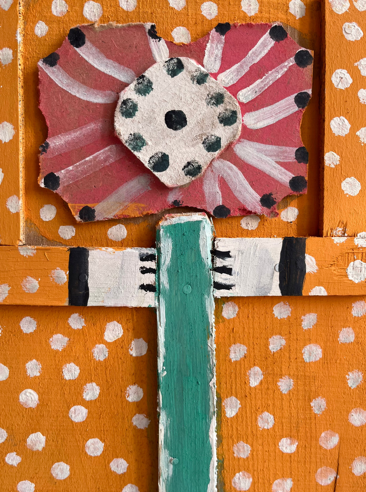 Wooden Figure with a Red Flower by Dionizy