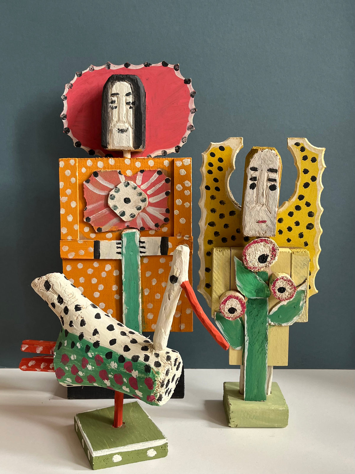 Wooden Figure with a Flower by Dionizy